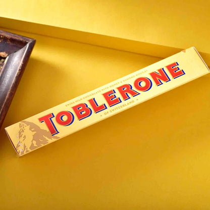 Toblerone Rakhi Hamper – Crunchy Almond Chocolate with Rakhi Roli Chawal